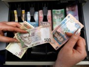 Украинская гривна обвалилась к доллару до трехлетнего минимума